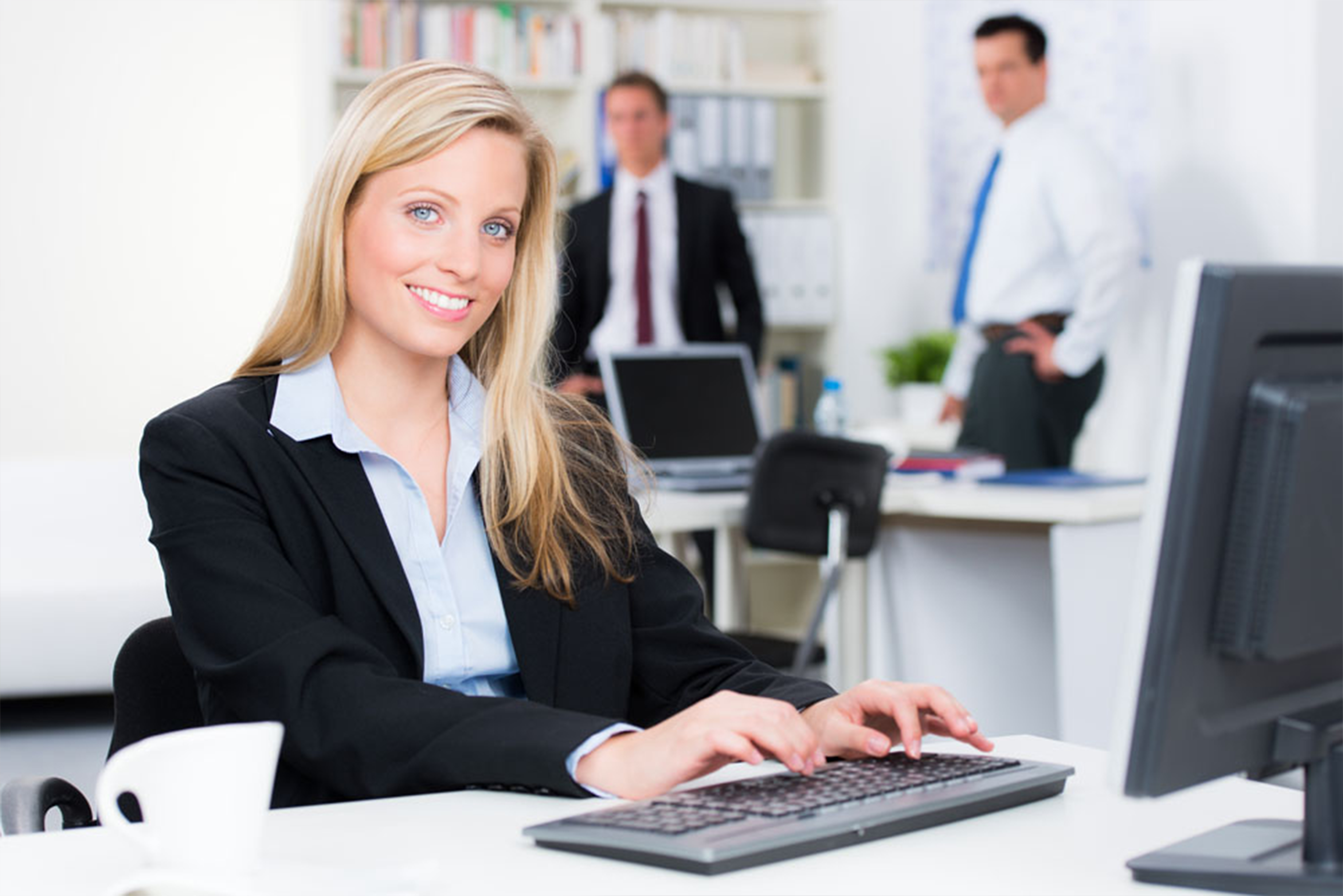business women typing on computer