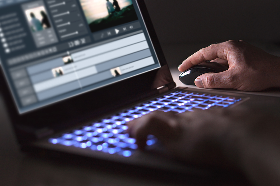 Video editing with laptop. Professional editor adding special ef